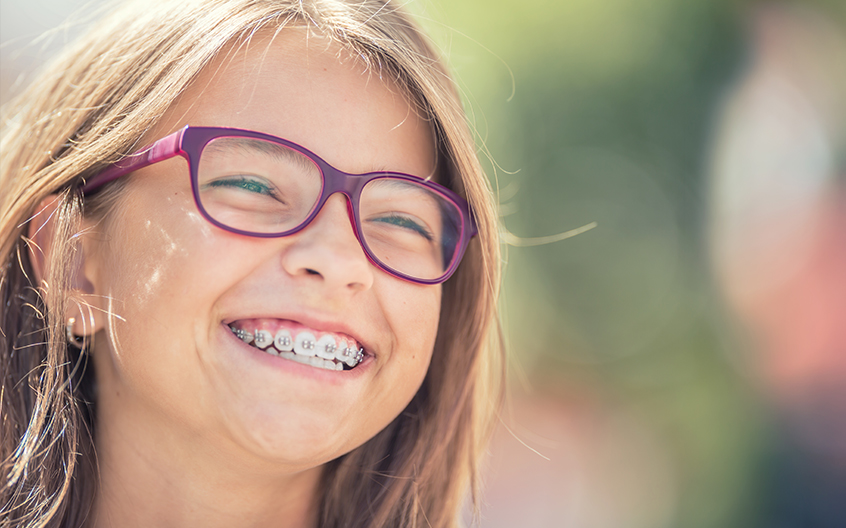 Smiling girl with braces