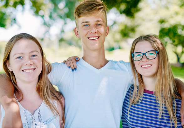 Smiling teenagers.
