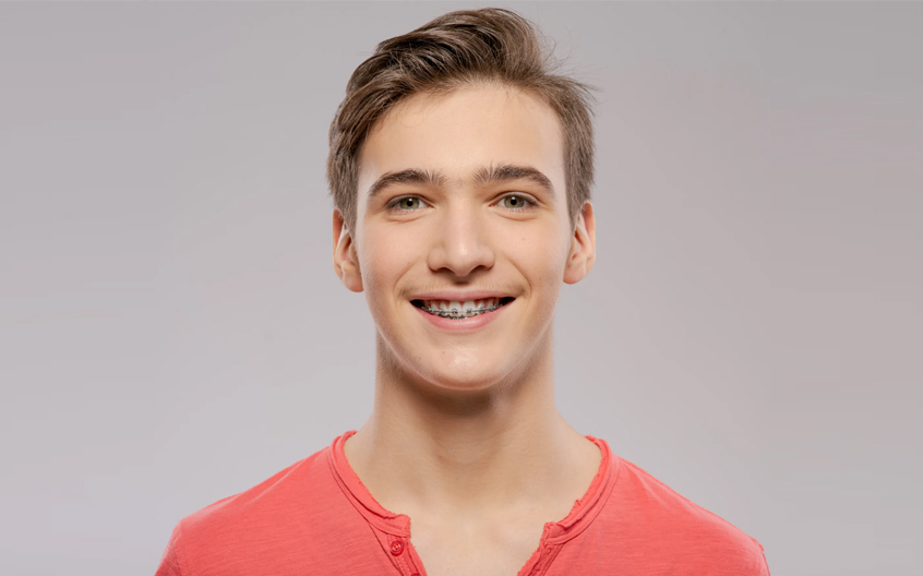 A teenage boy with braces.